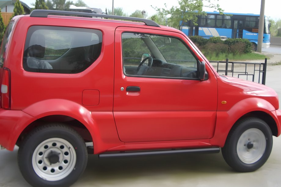 Suzuki Jimny 1998-2018 рр. Бічні труби Black (2 шт., нерж) Фото 1