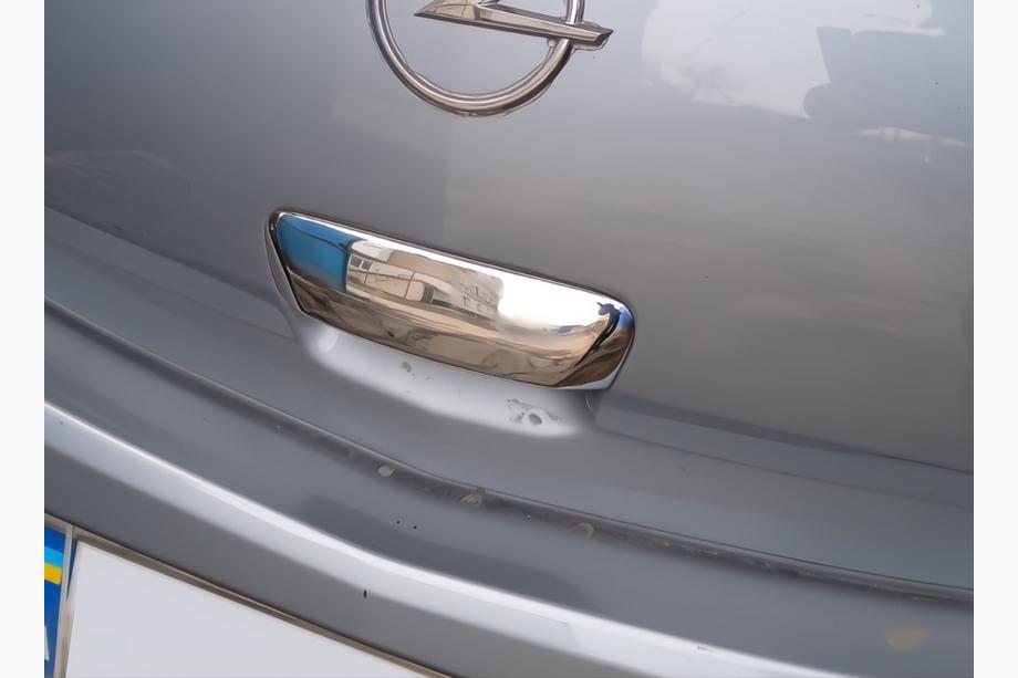 Opel Corsa D 2007-2014 рр. Накладка на ручку задніх дверей (нерж) Image